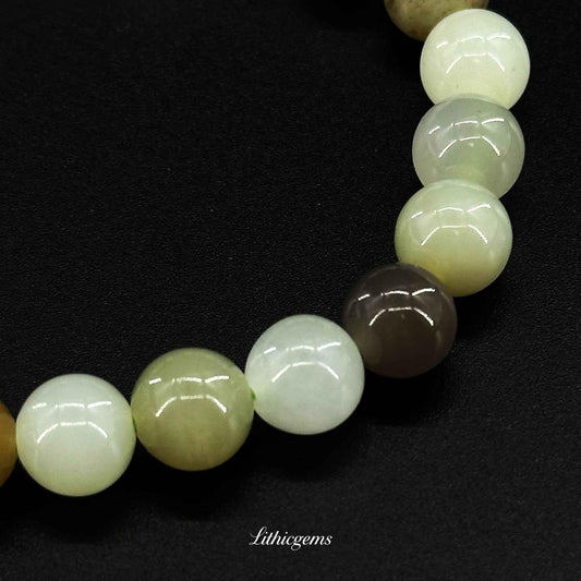 Natural crystal gemstone beaded bracelet on black background, Lithicgems boutique jewelry.