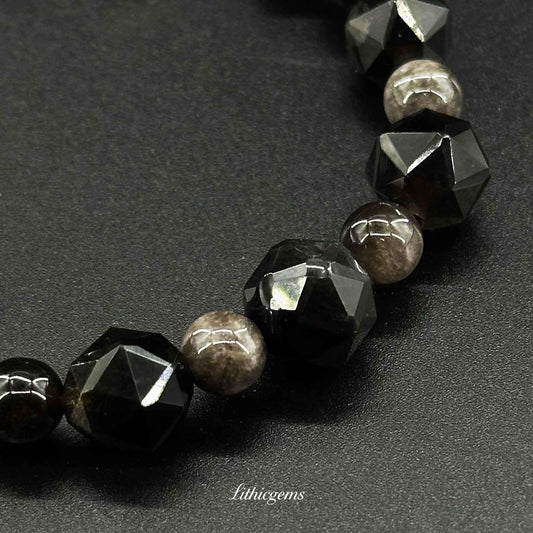 Faceted black gemstone and round smoky crystal beaded bracelet on dark background, Lithicgems