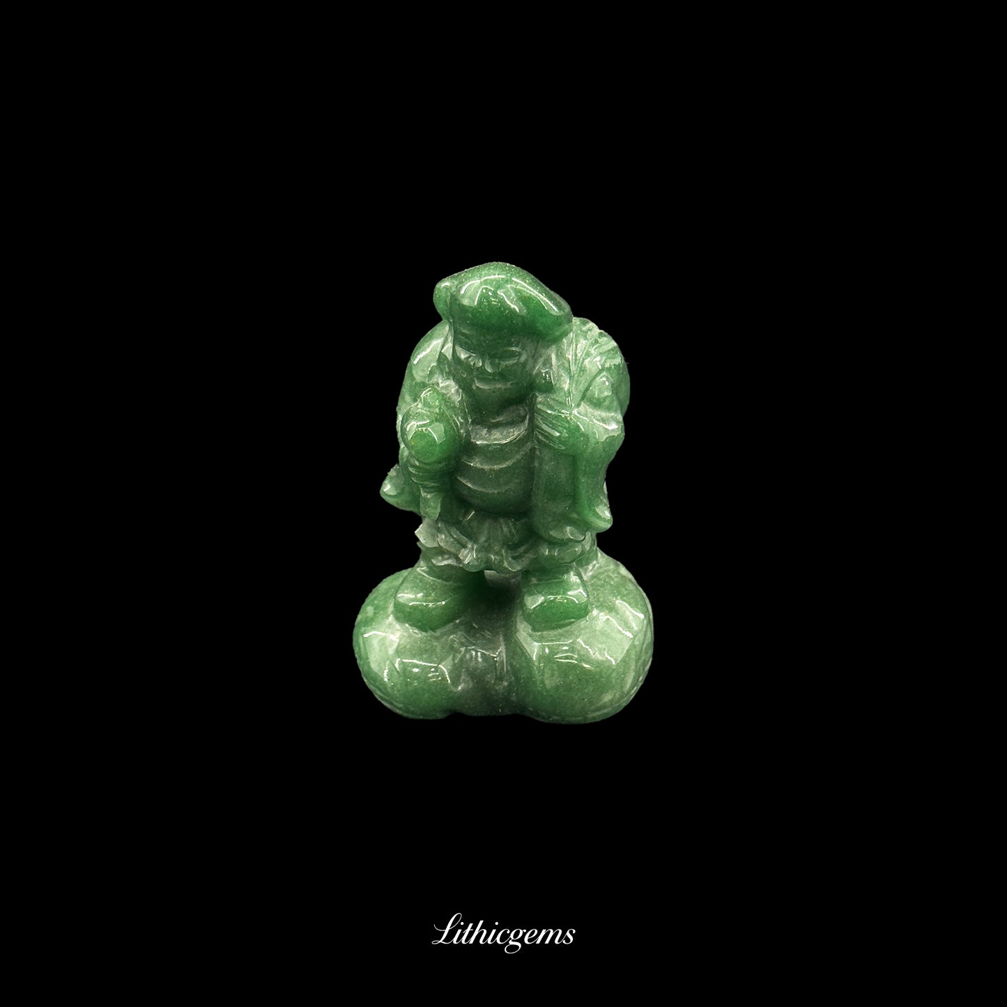 Green gemstone figurine of a standing character with detailed clothing on a black background, Lithicgems
