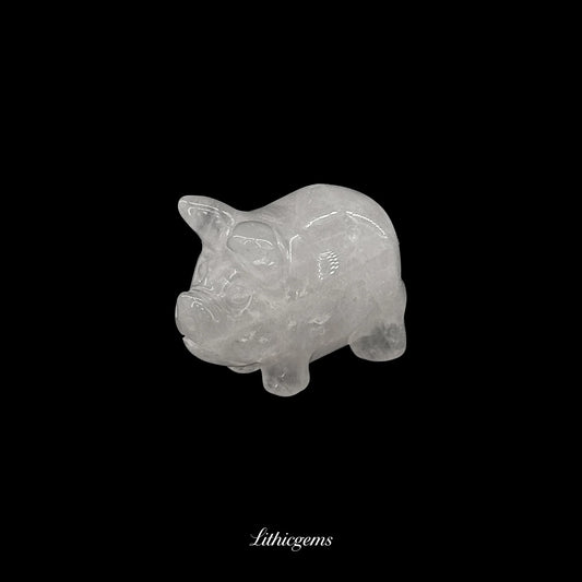 Clear quartz crystal pig figurine on black background, Lithicgems premium gemstone boutique