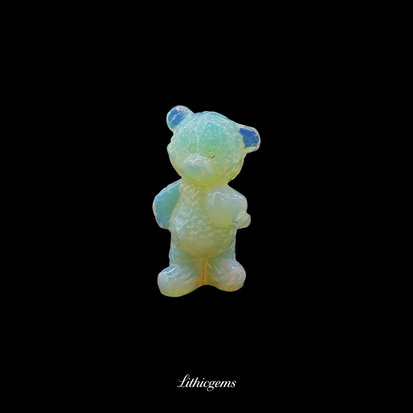 Opalite crystal bear figurine from Lithicgems on black background