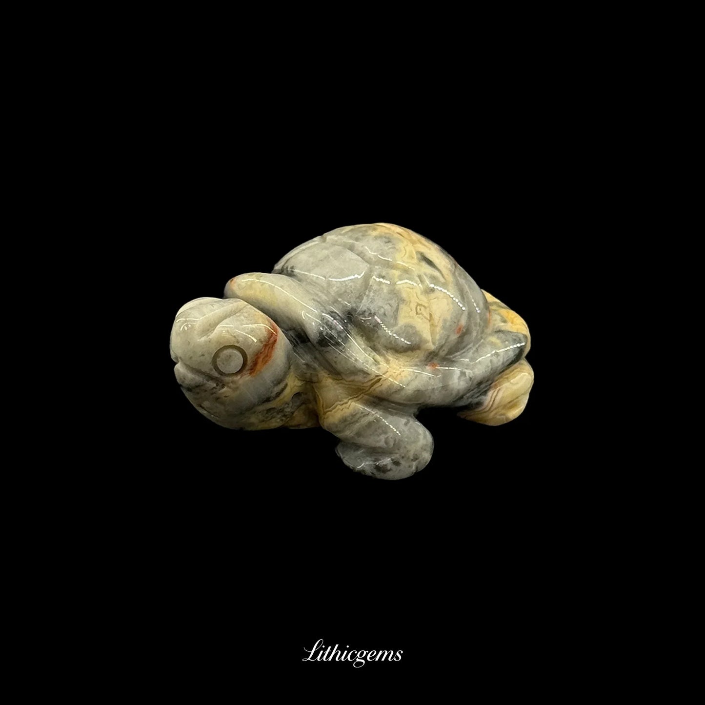 Natural gemstone turtle figurine on black background, Lithicgems crystal decor