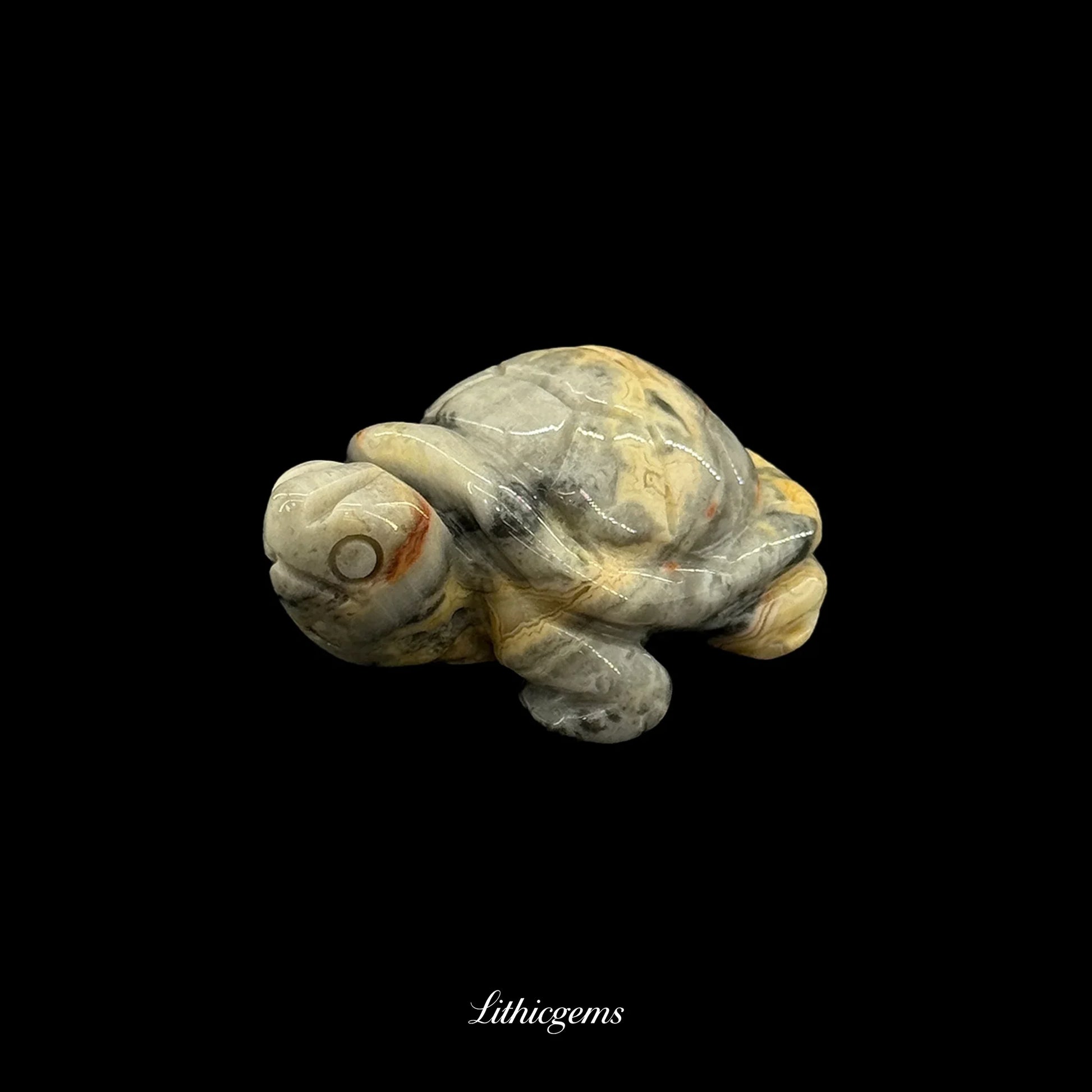 Natural gemstone turtle figurine on black background, Lithicgems crystal decor