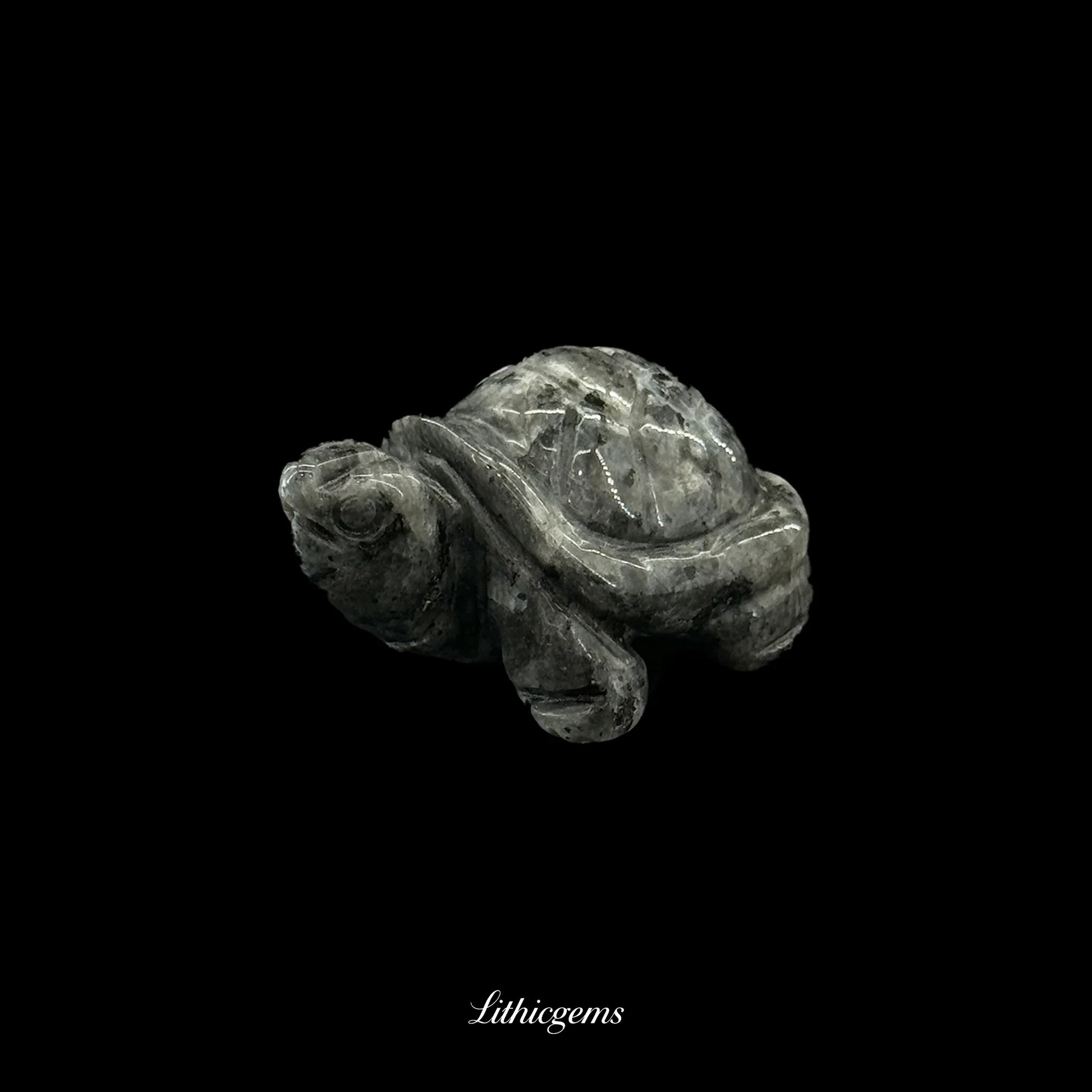 Grey crystal turtle figurine, natural gemstone carving on black background, Lithicgems boutique