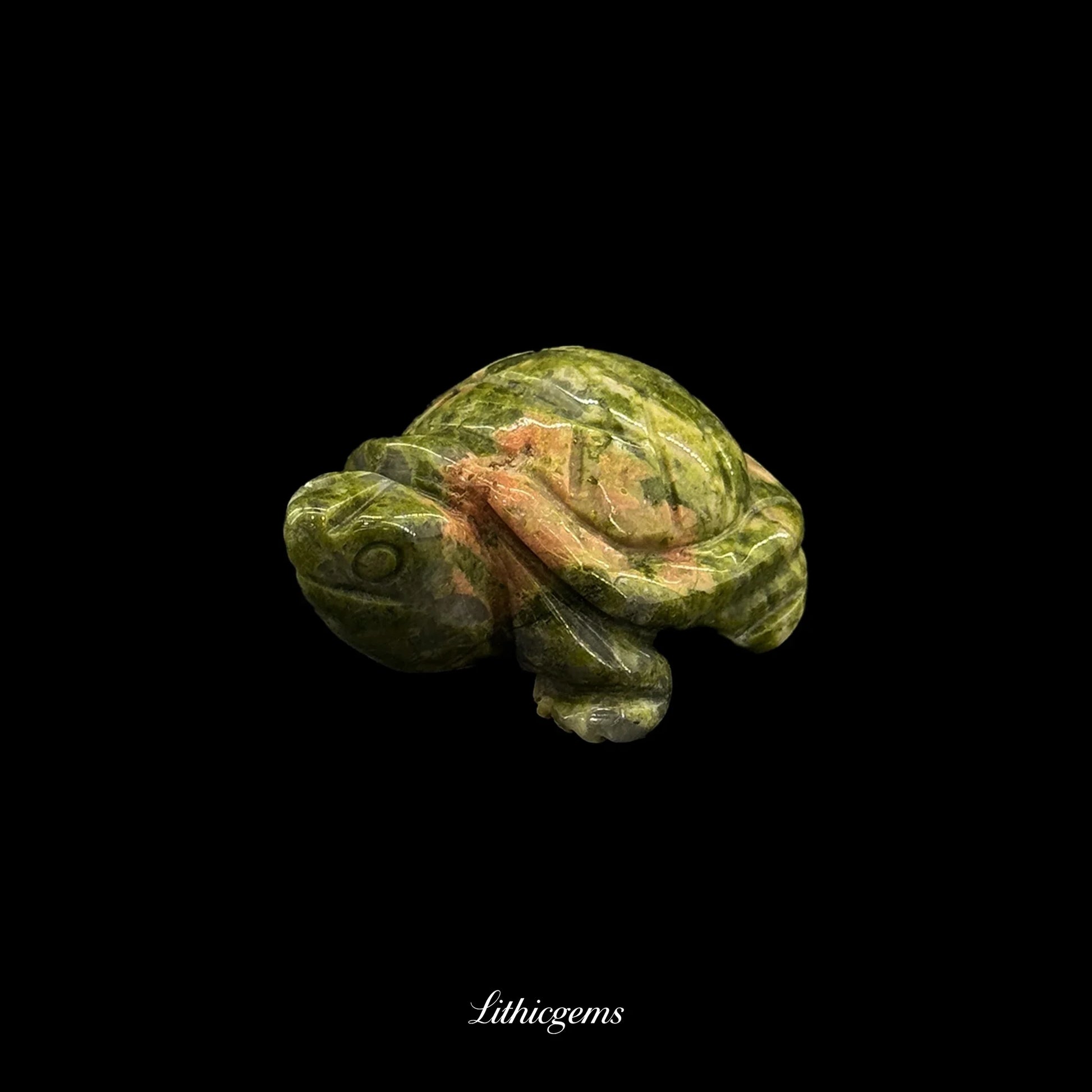 Green gemstone turtle figurine on black background, Lithicgems crystal boutique