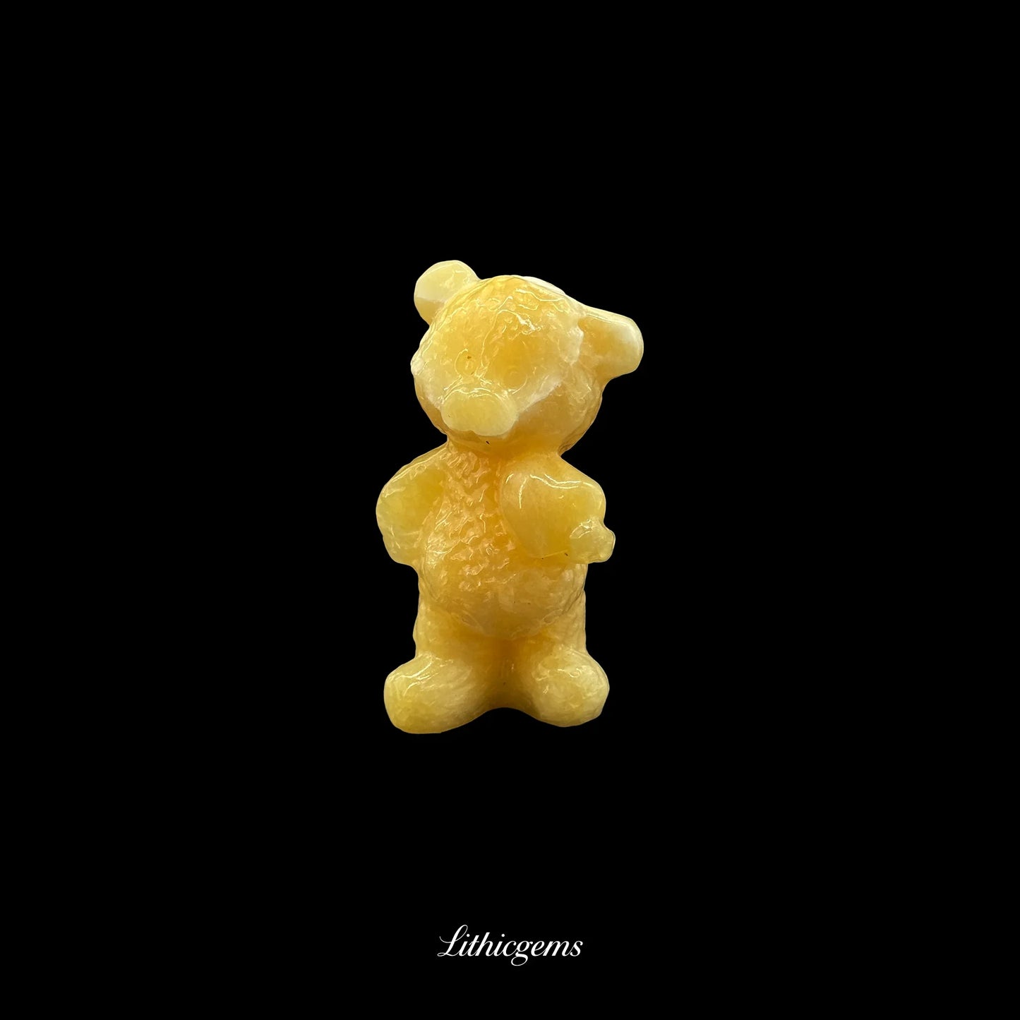 Yellow crystal bear figurine on black background, Lithicgems natural gemstone boutique