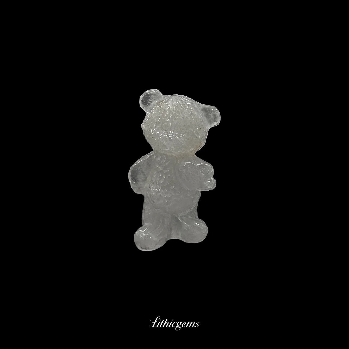 Clear crystal bear figurine on black background, premium Lithicgems gemstone display