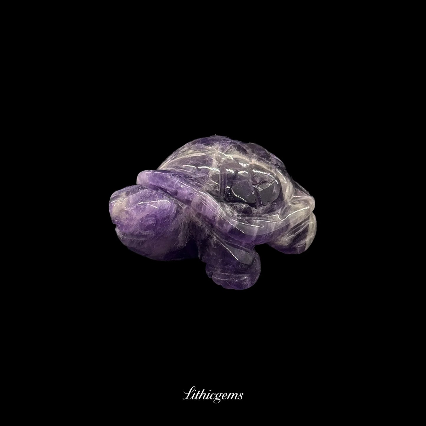Amethyst crystal turtle figurine on black background, Lithicgems premium gemstone