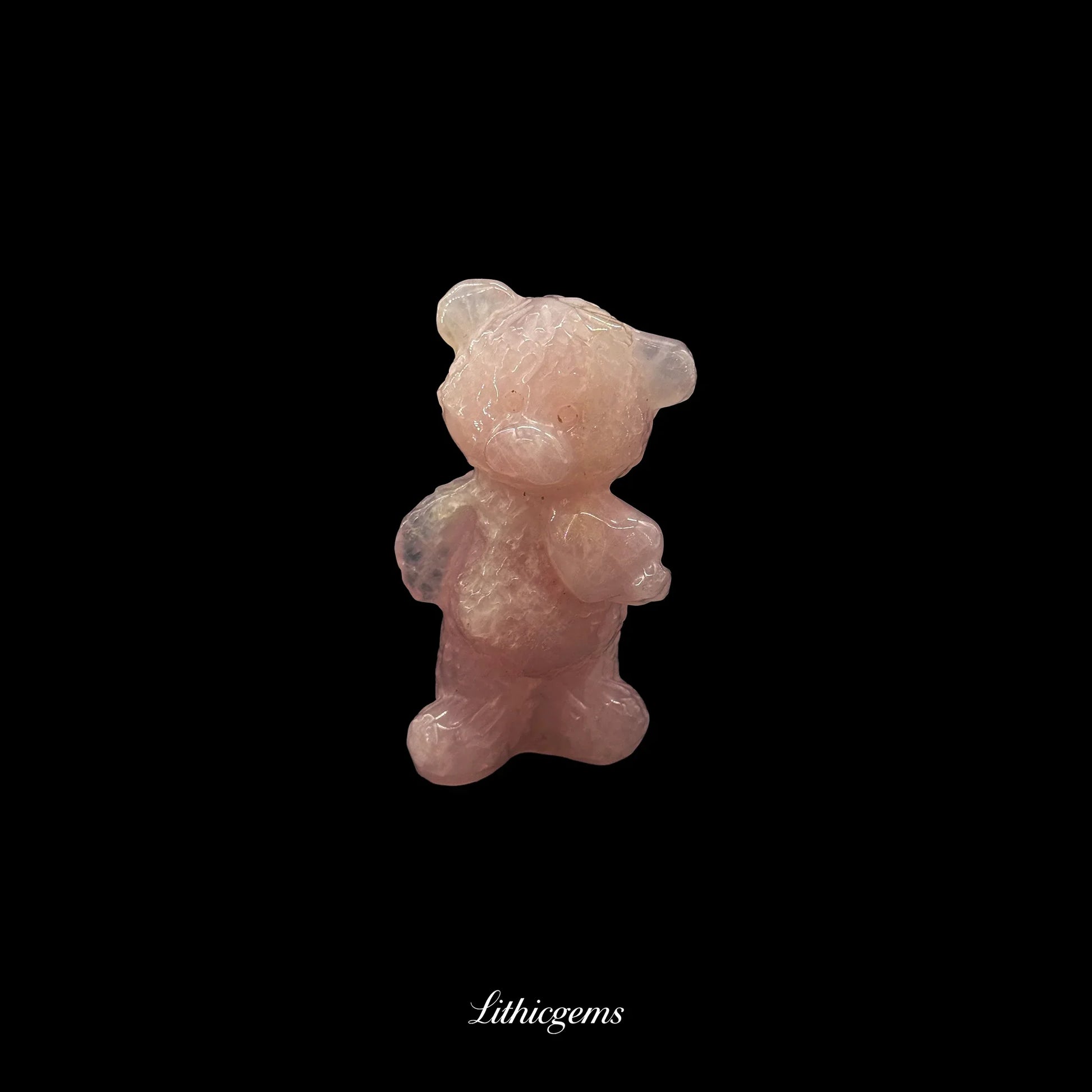 Rose quartz teddy bear crystal figurine on black background, Lithicgems boutique