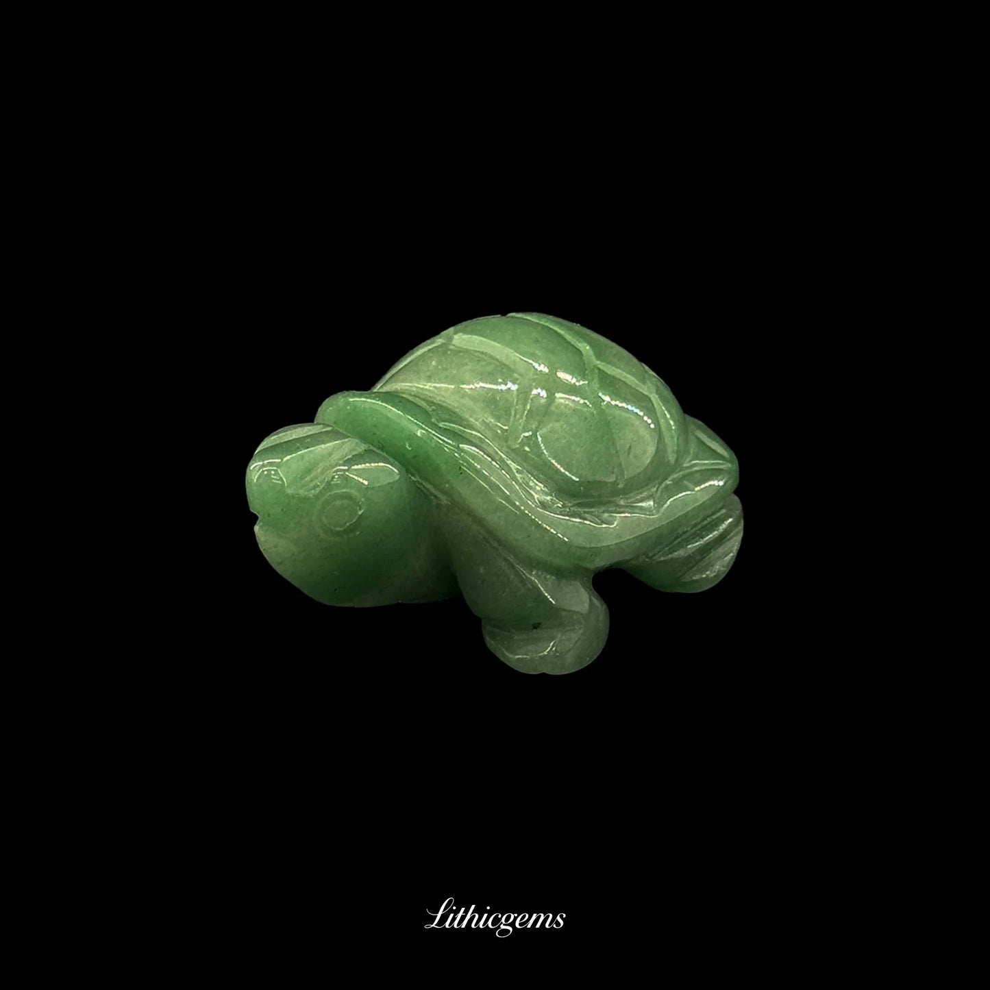 Green crystal turtle figurine on black background, Lithicgems natural gemstone carving